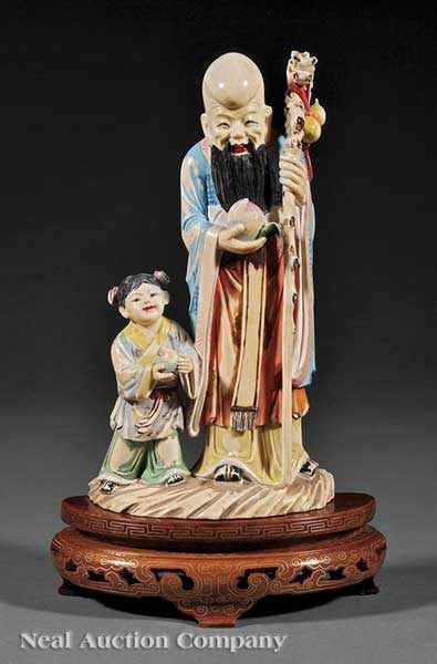 Appraisal: A Chinese Polychromed Ivory Figural Group of Shoulao and a