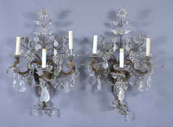 Appraisal: PAIR MAISON BAGU S GILT-METAL AND GLASS THREE-LIGHT SCONCES Circa