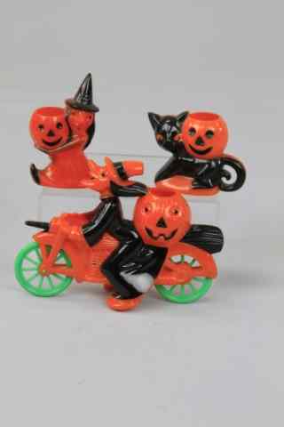 Appraisal: GROUPING OF THREE HALLOWEEN TREAT CONTAINERS Comical witch rides motorcycle