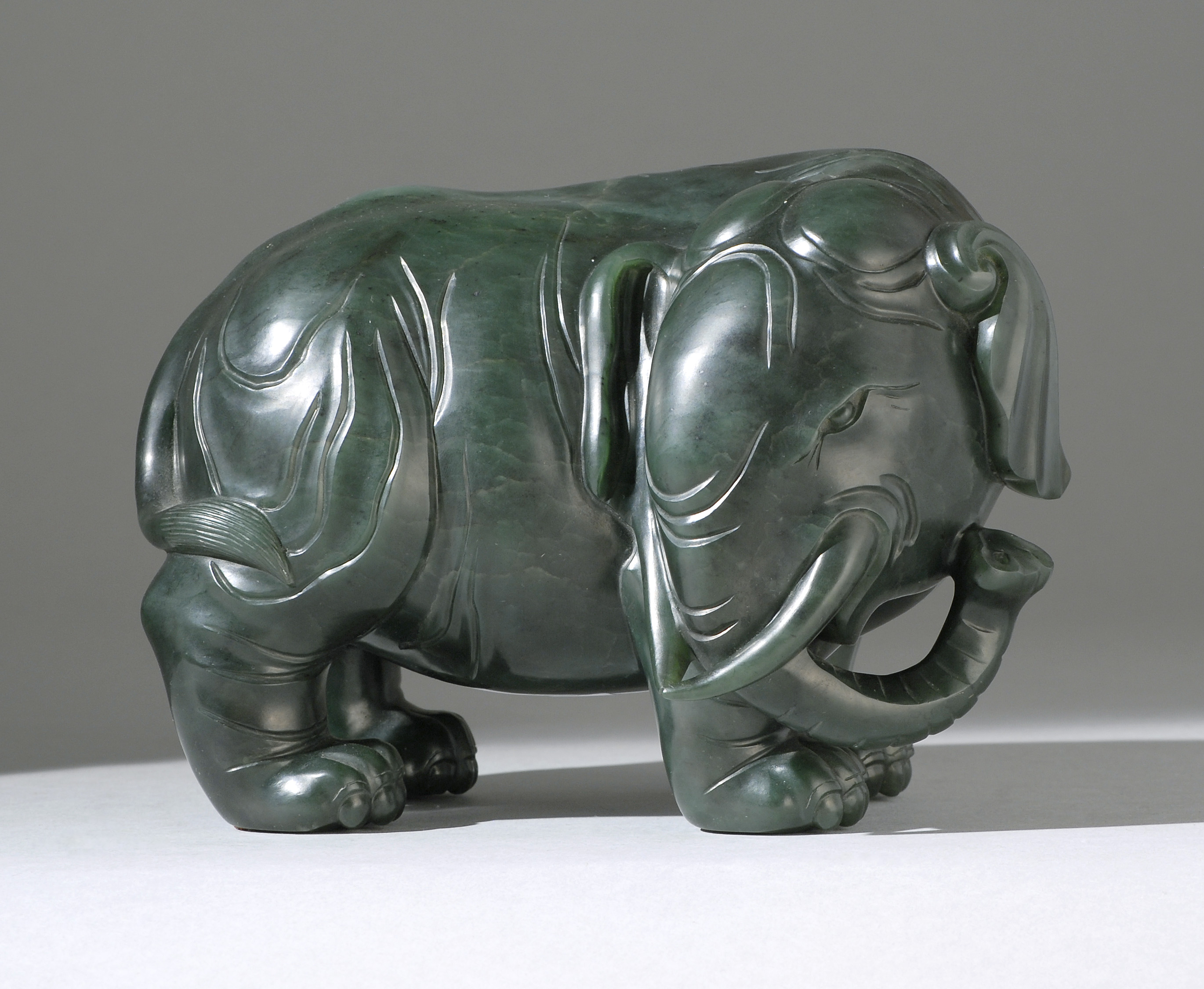 Appraisal: SPINACH-GREEN JADE ELEPHANT th CenturyIn standing position with its head