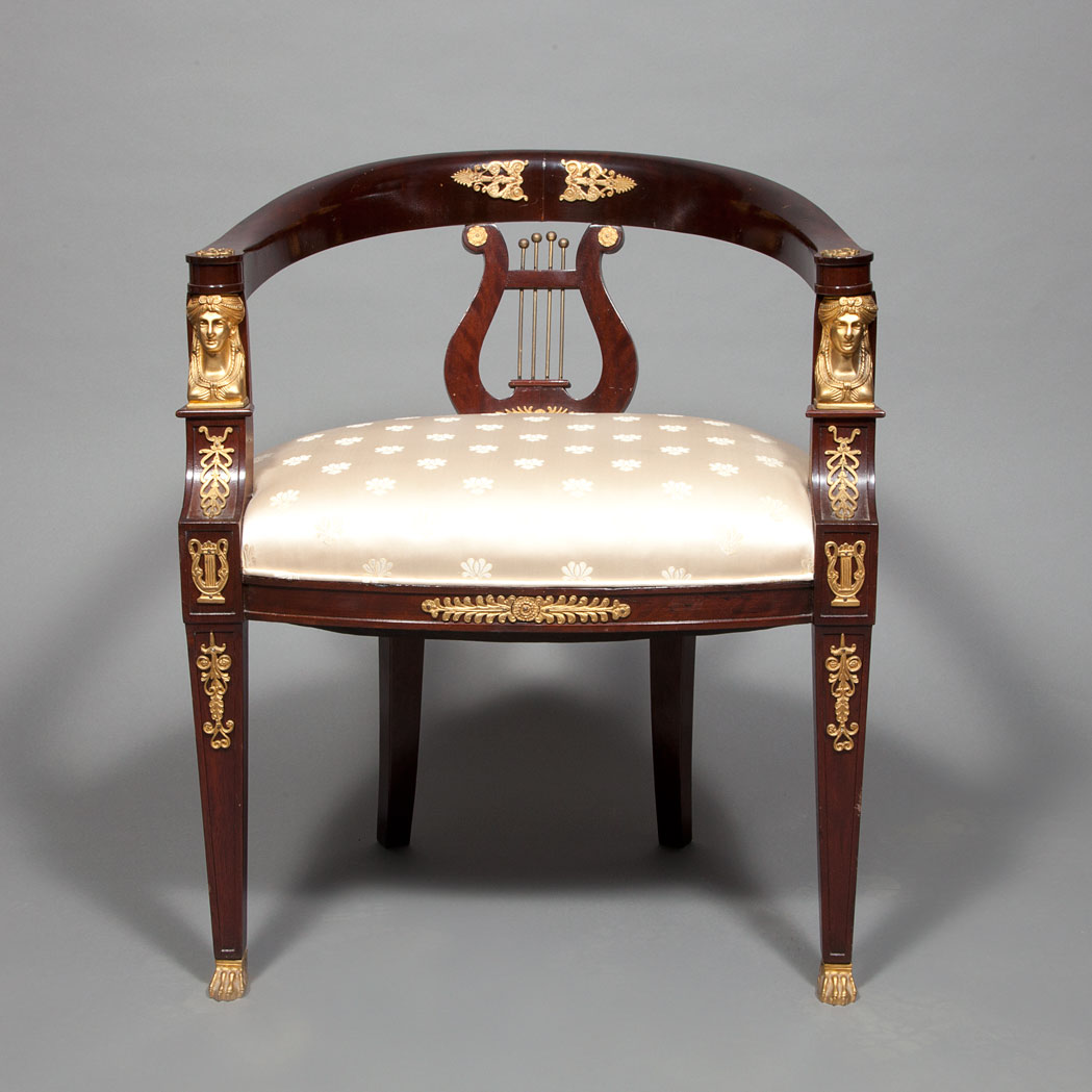 Appraisal: Empire Style Gilt-Metal Mounted Mahogany Armchair The curved crest above