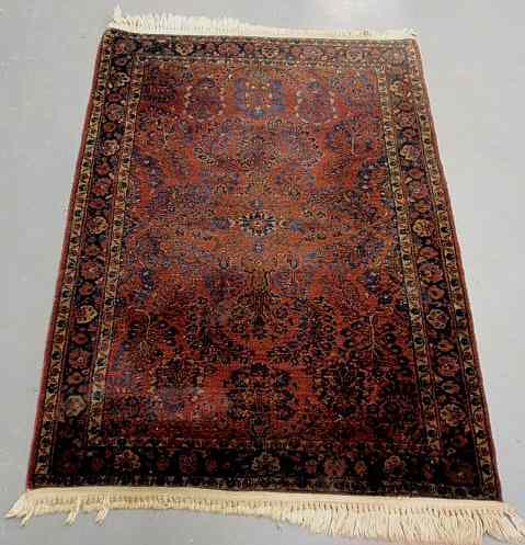 Appraisal: Sarouk oriental hall mat red field and blue floral patterns