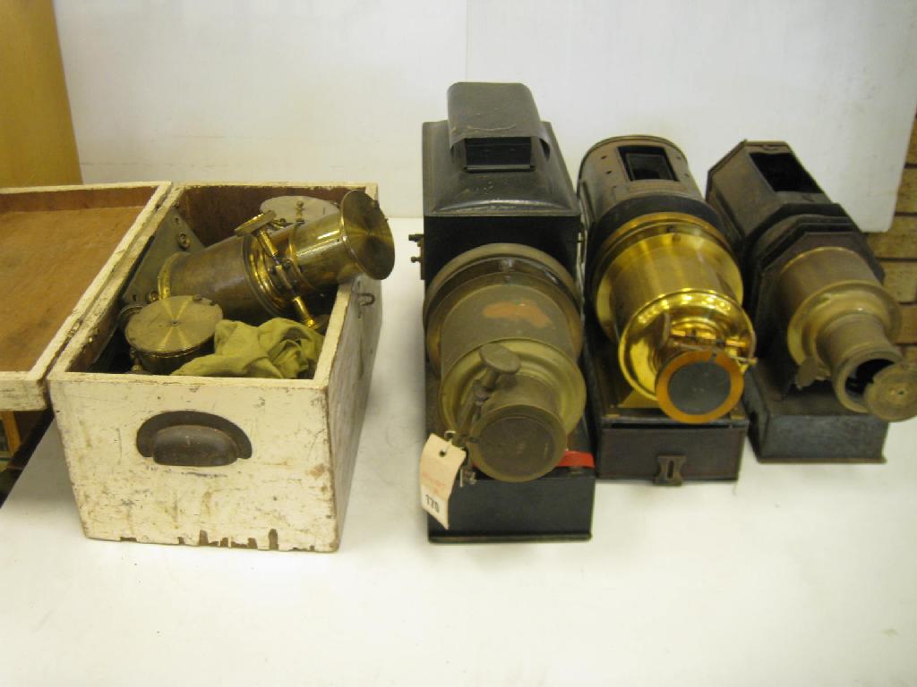 Appraisal: Three brass and tin plate Magic Lanterns and a set