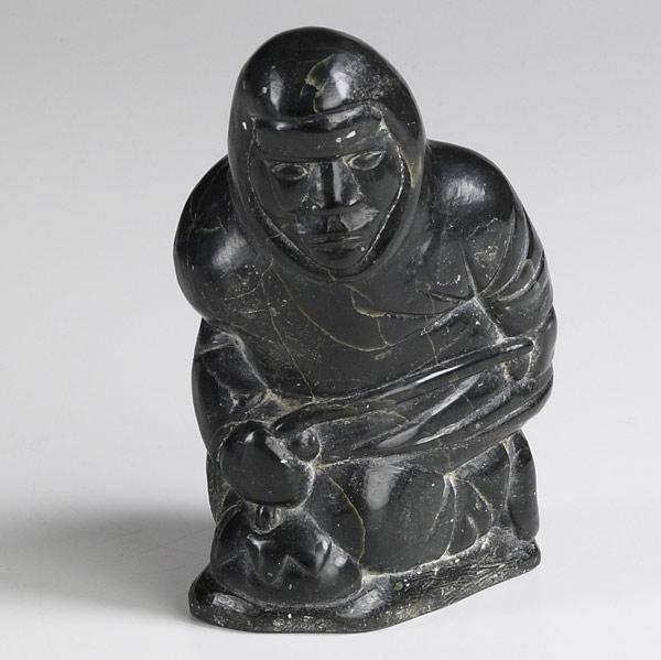 Appraisal: INUIT GREEN SOAPSTONE CARVING Of an ice fisherman early to