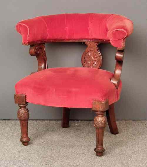 Appraisal: A Victorian walnut framed library armchair with low horse-shoe pattern