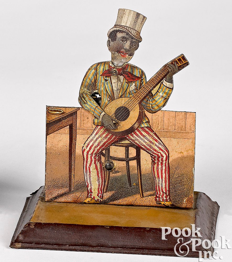 Appraisal: Schoenner tin banjo player steam toy accessory Schoenner painted and