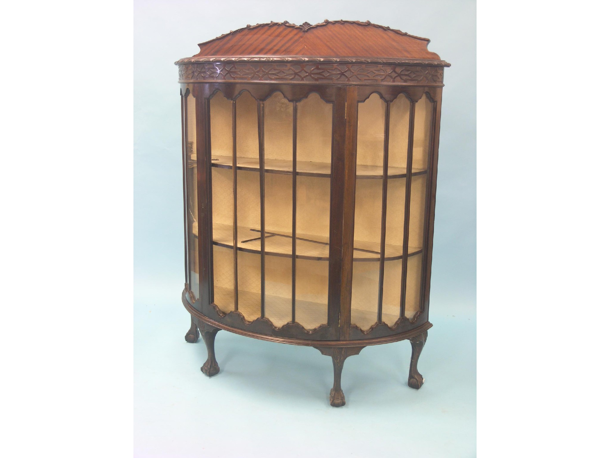 Appraisal: An early th century mahogany display cabinet half-round shape with