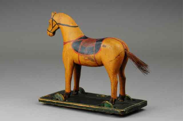 Appraisal: WOODEN HORSE ON PLATFORM Carved full figure of horse with