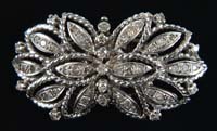 Appraisal: K WHITE GOLD AND DIAMOND PENDANT BROOCH x - floral