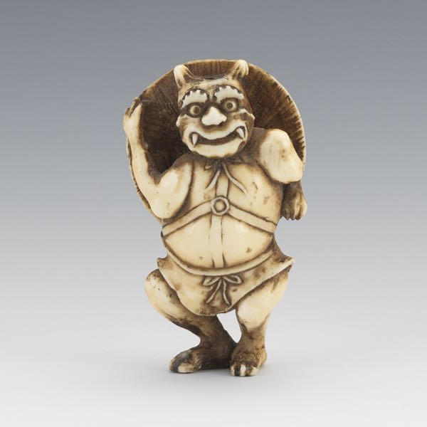 Appraisal: JAPANESE CARVED WALRUS TUSK NETSUKE OF DEMON SPIRIT WITH TORTOISE