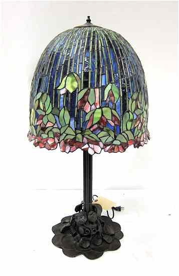 Appraisal: TIFFANY INSPIRED FLOWERING LOTUS TABLE LAMP featuring a colorful model