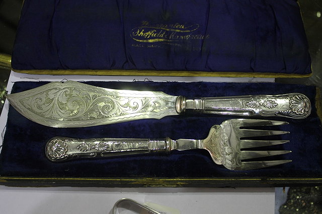 Appraisal: A PAIR OF SILVER SHELL PATTERN FISH SERVERS with embossed