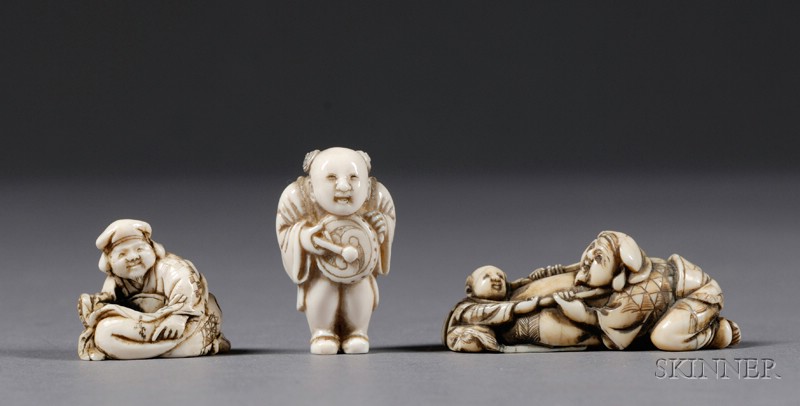 Appraisal: Three Ivory Netsuke th century a boy with a drum