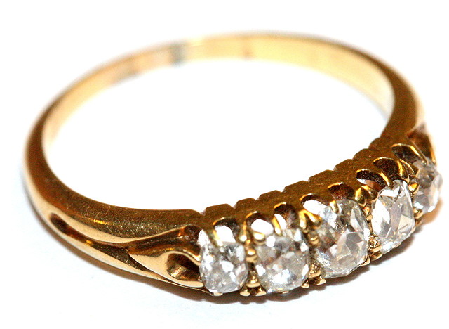 Appraisal: A GRADUATED FIVE STONE DIAMOND RING claw set with old