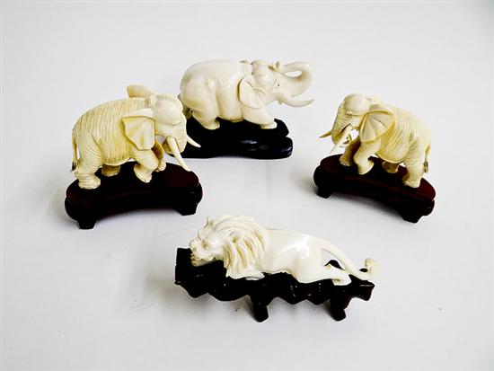 Appraisal: FOUR CARVED IVORY AMINALS Asia st half- th century Pair