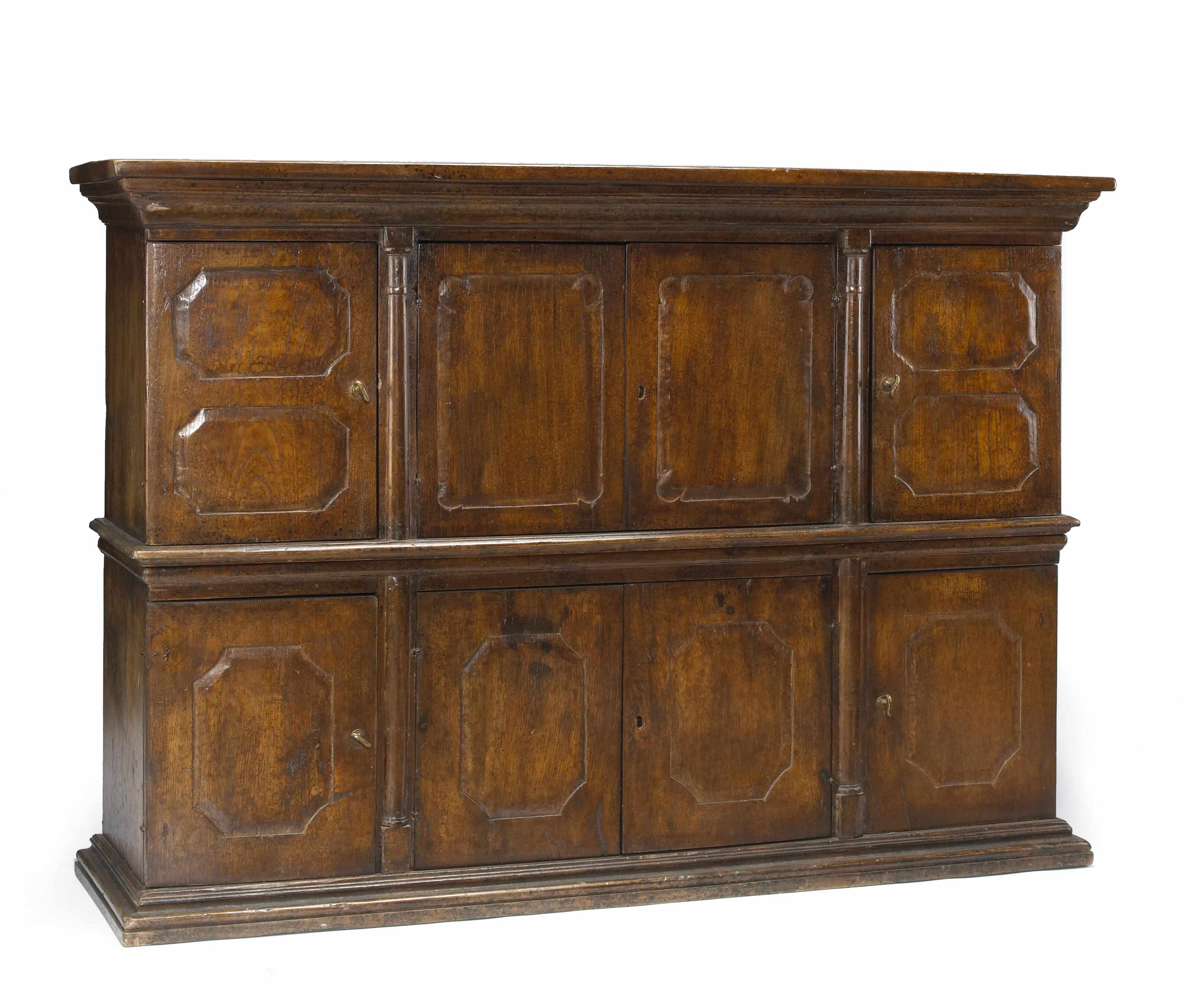 Appraisal: An Italian Baroque walnut cabinet incorporating antique and later elements