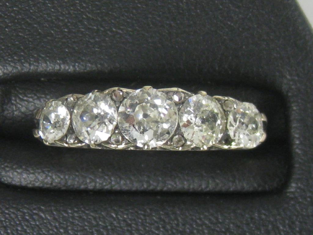 Appraisal: A five stone Diamond Ring the old-cut graduated stones pave-set