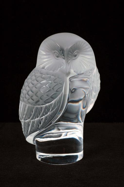 Appraisal: A clear glass with frosted highlights figure of a perched