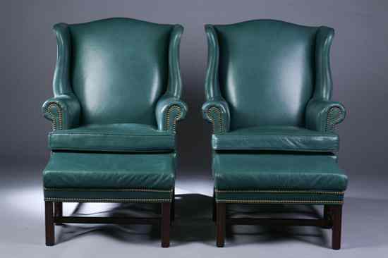 Appraisal: PAIR CHIPPENDALE STYLE NAILED LEATHER EASY CHAIRS WITH OTTOMANS th