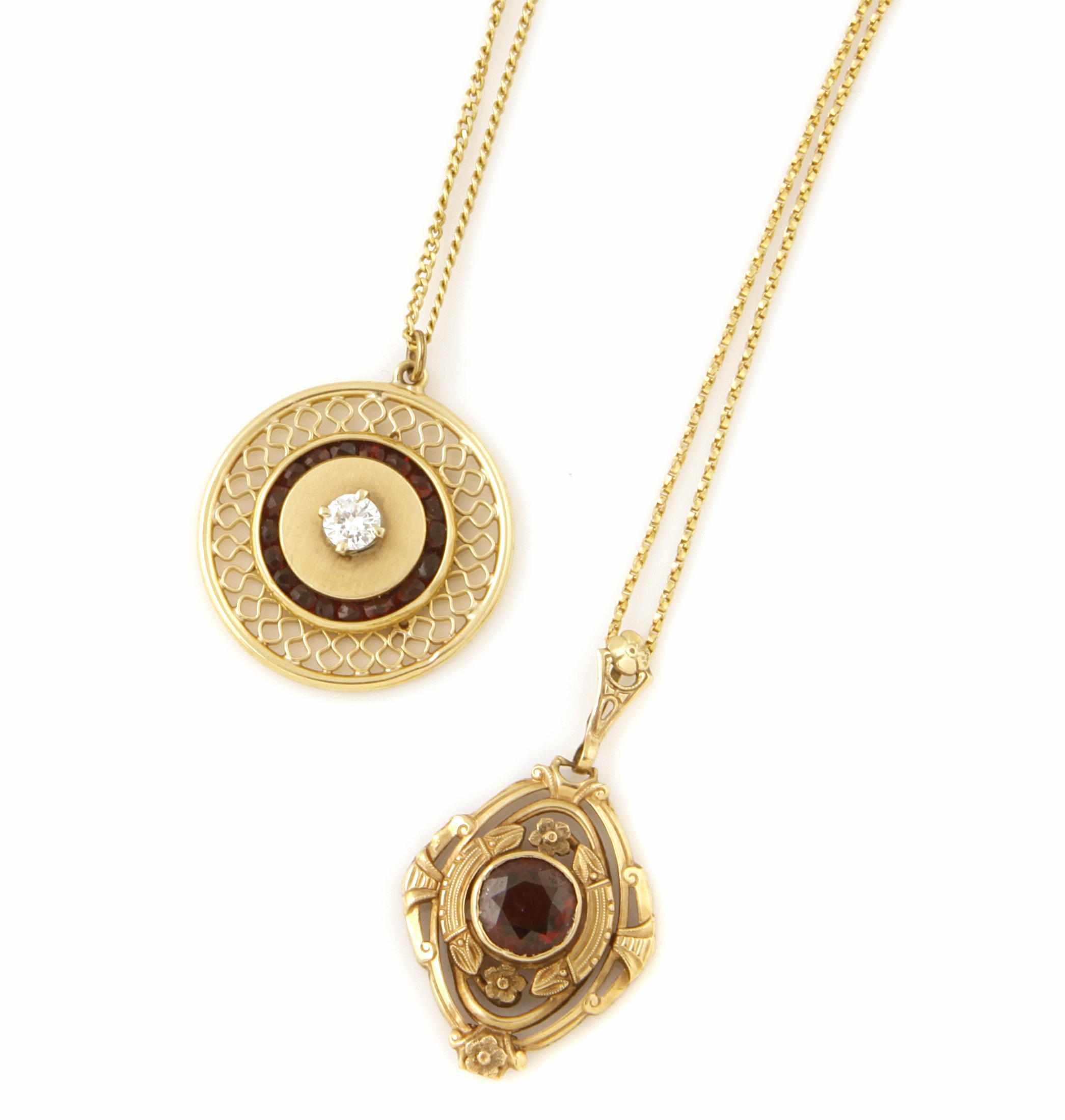 Appraisal: Two diamond red stone and gold pendants with chains lengths