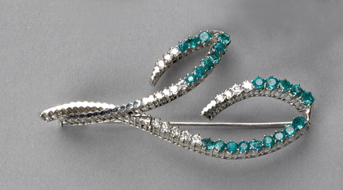 Appraisal: Emerald and diamond brooch in K white gold with round