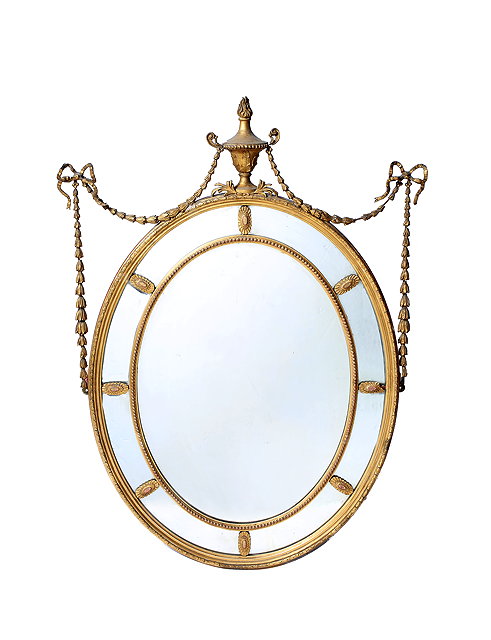 Appraisal: A TH CENTURY OVAL GILT GESSO FRAMED WALL MIRROR with