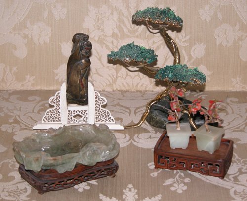 Appraisal: Title Oriental Figure on Ivory Stand Miniature Jade Trees Brass