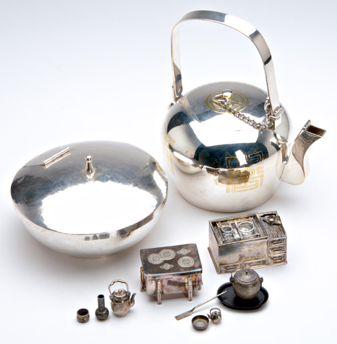 Appraisal: JAPANESE SILVER Teapot with gilt characters lid attatched by chain