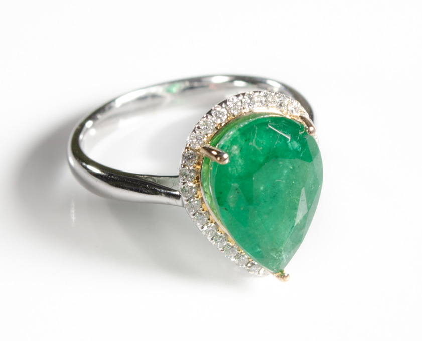 Appraisal: EMERALD DIAMOND AND FOURTEEN KARAT GOLD RING with round-cut diamonds