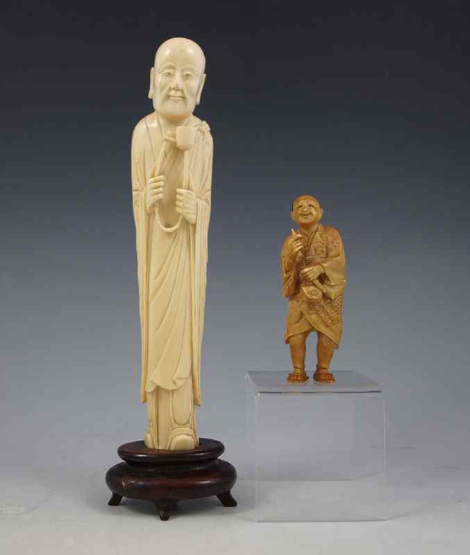 Appraisal: CARVED IVORY FIGURES Elder ''h Signed on the back of