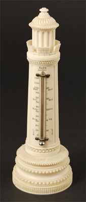 Appraisal: A th century ornamentally turned ivory desk thermometer of lighthouse