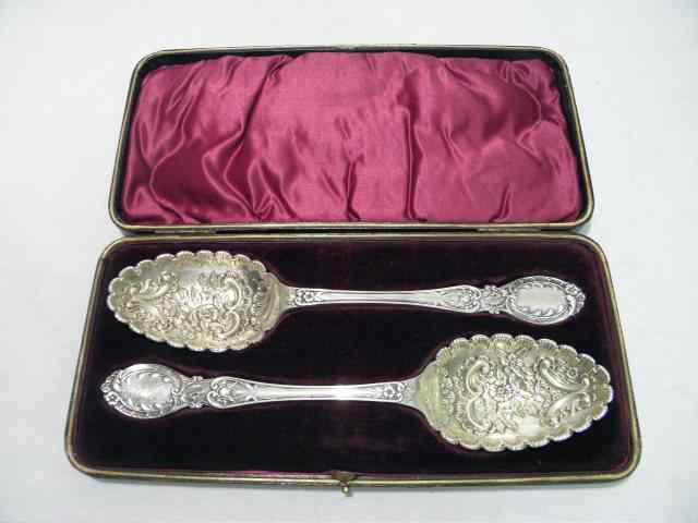 Appraisal: Pair floral heavy sterling silver serving spoons Unmarked Embossed engraved