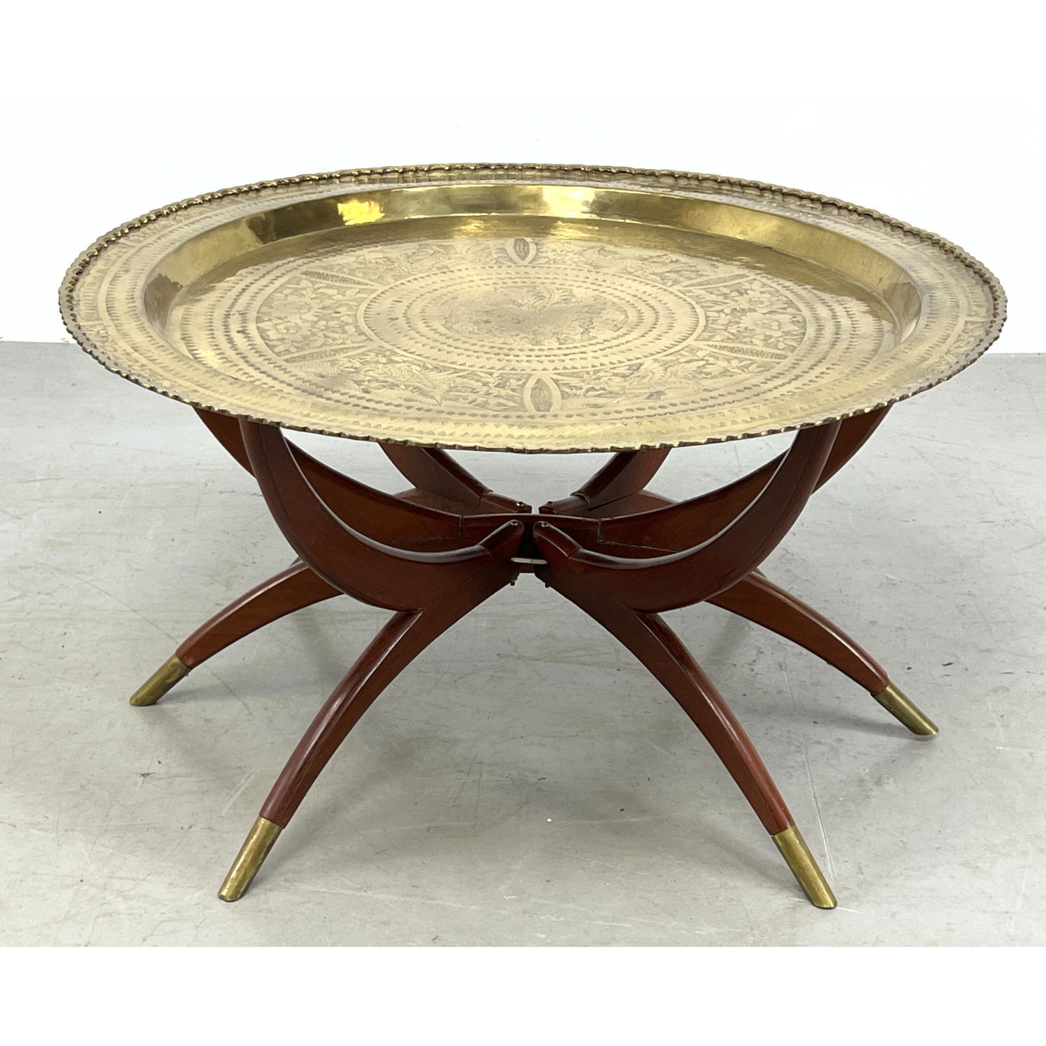 Appraisal: Round brass coffee tray table on a wood spider frame