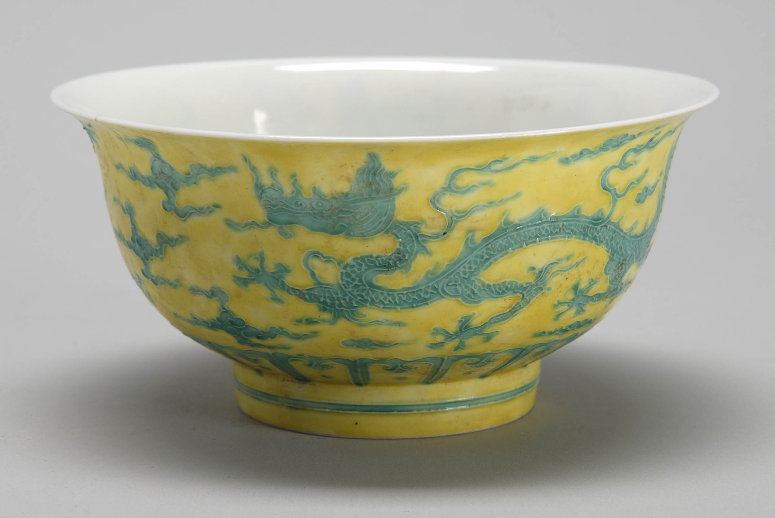 Appraisal: TWO-COLOR PORCELAIN BOWL In bell form with relief green dragon