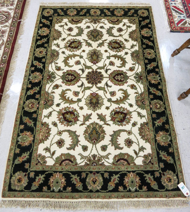 Appraisal: ORIENTAL AREA RUG Indo-Persian hand knotted in an overall floral