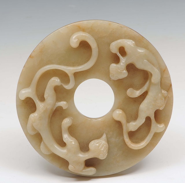 Appraisal: A Chinese greyish white jade bi discChou style carved in