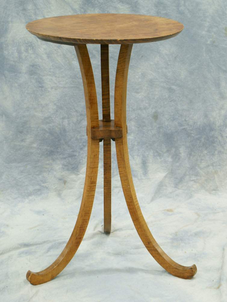 Appraisal: Oval figured maple candlestand scrolled leg base with birds nest