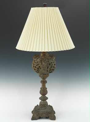 Appraisal: An Ornate Spelter Table Lamp Cast metal table lamp with