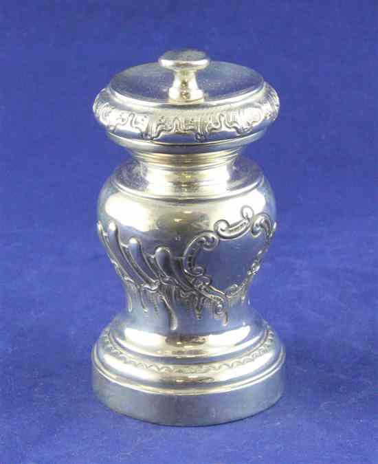 Appraisal: A late Victorian repousse silver pepper mill of baluster form