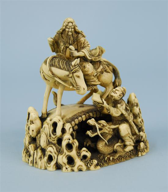 Appraisal: JAPANESE CARVED IVORY FIGURAL GROUP depicting a horseman crossing a