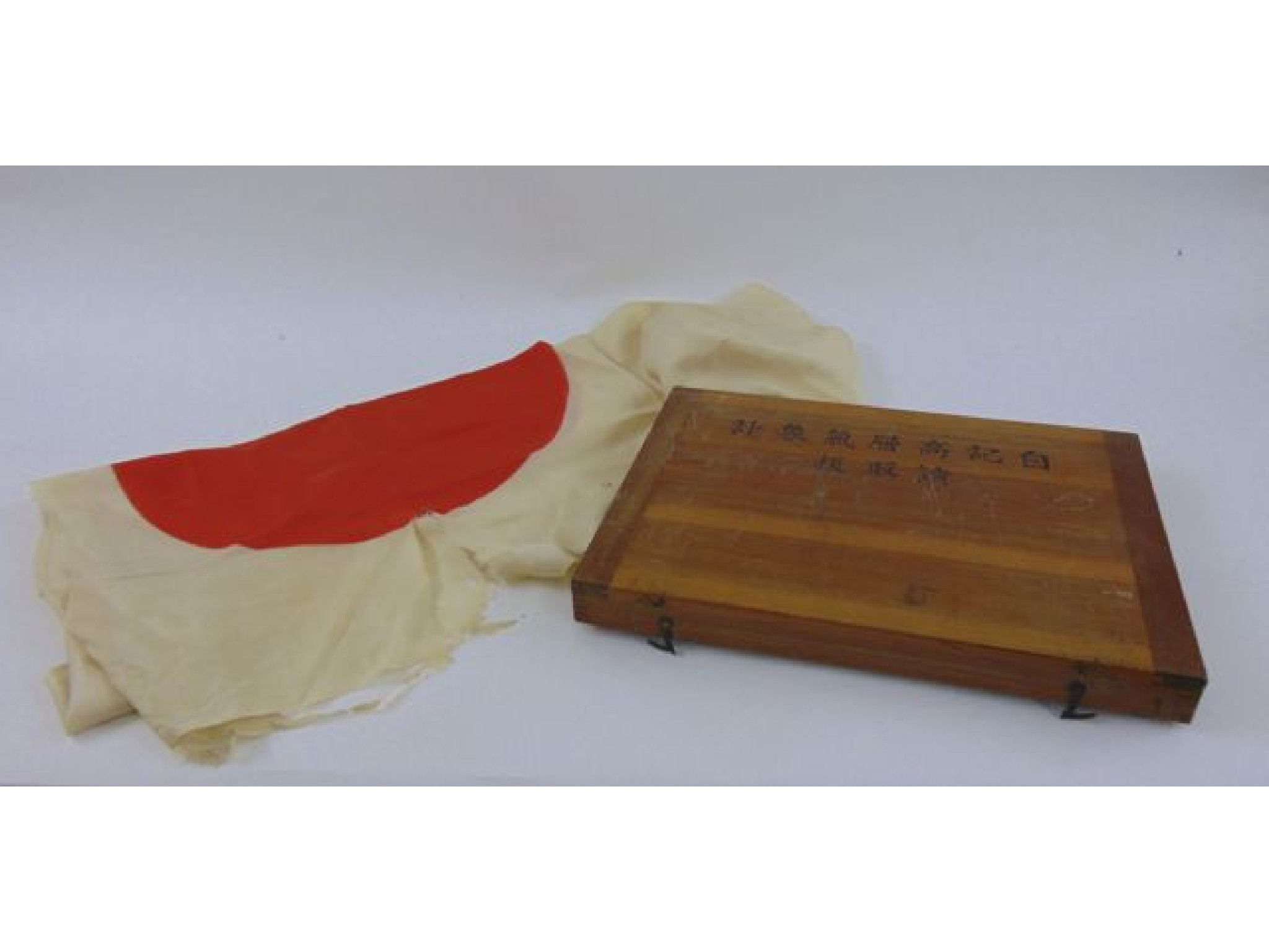 Appraisal: A silk Japanese flag set within a timber box