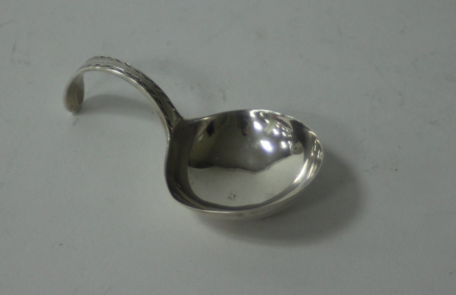 Appraisal: A Georgian silver caddy spoon maker's mark and lion passant