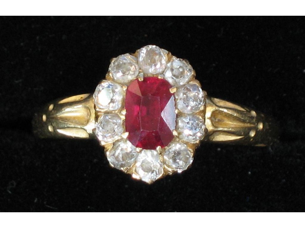 Appraisal: A RUBY AND DIAMOND CLUSTER RING the central oval cushion-cut