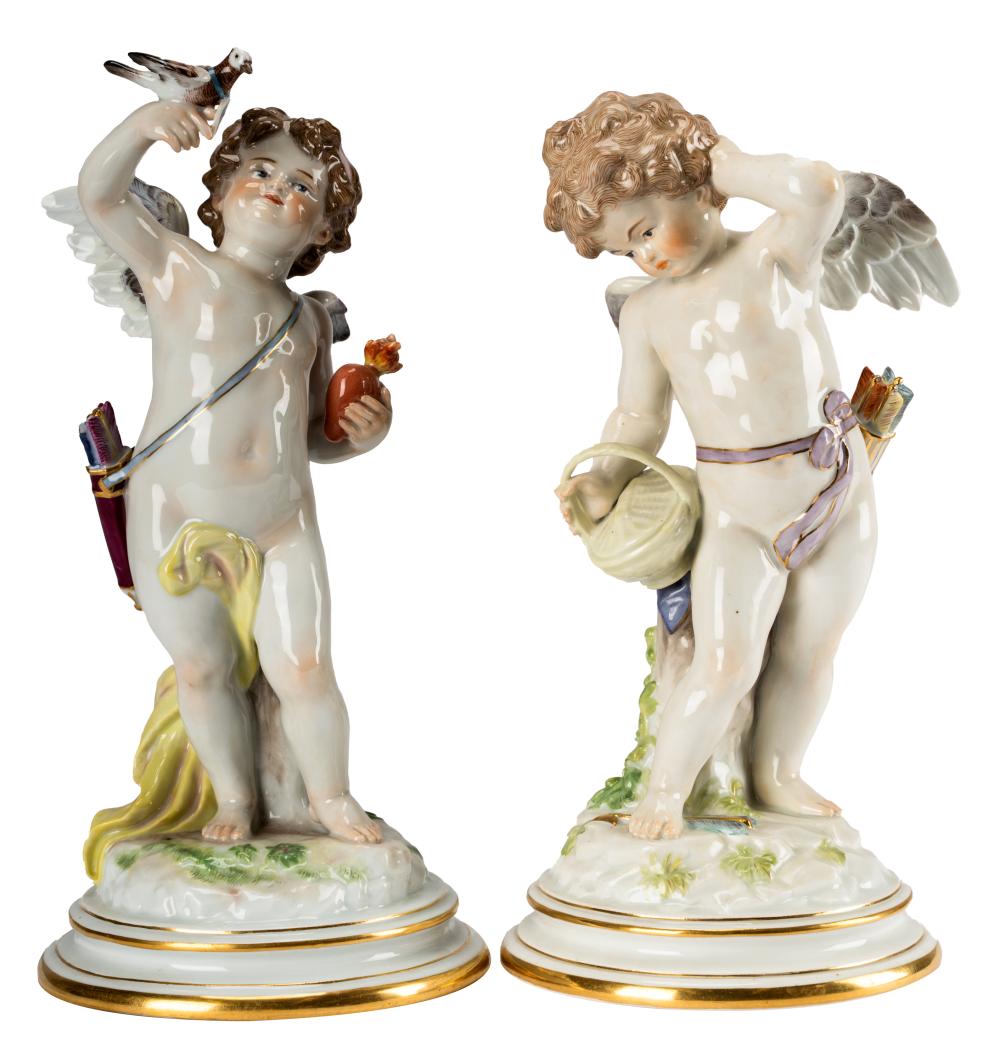 Appraisal: TWO MEISSEN ENAMELED PORCELAIN STATUES OF CUPIDunderglaze blue crossed swords