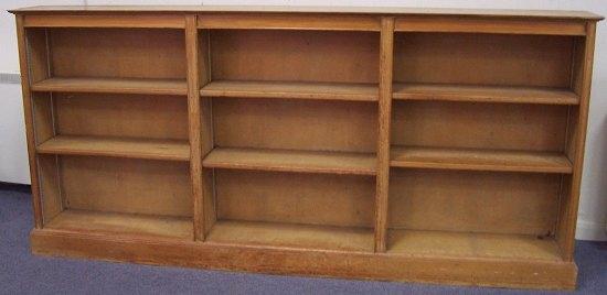 Appraisal: A waxed pine open bookcase on a plinth base cm