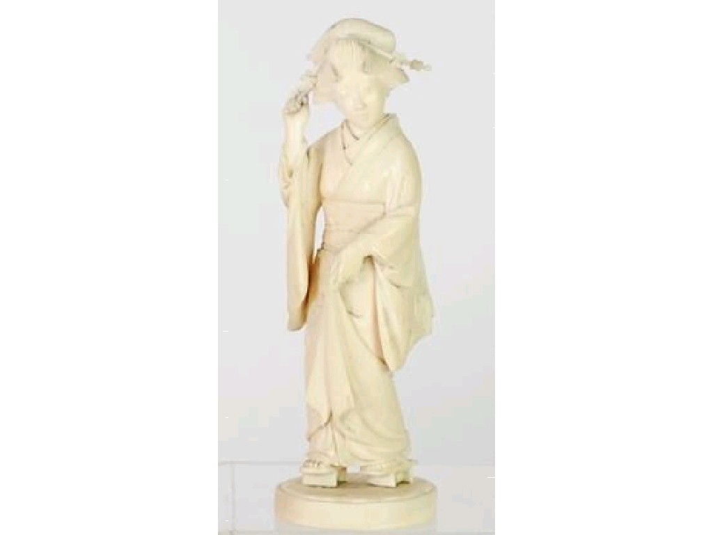 Appraisal: JAPANESE WELL CARVED IVORY OKIMONO of an elegantly robed and