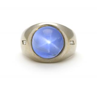 Appraisal: A HIGH DOME BLUE STAR SAPPHIRE RING IN WHITE GOLD