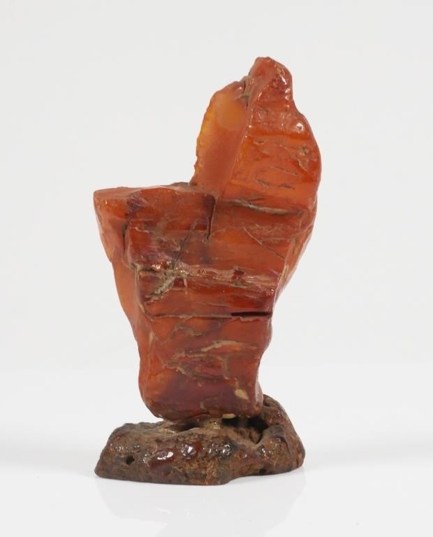 Appraisal: Baltic amber with carved eagle or phoenix to one side