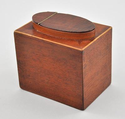 Appraisal: A Mahogany Tea Box Rectangular mahogany box has a lighter