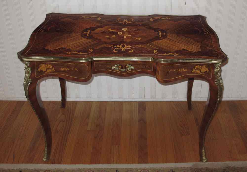 Appraisal: FRENCH STYLE INLAY AND ORMOLU DESK Marquetry inlaid top with